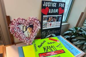 Signs brought by family and friends to the sentencing hearing in Kelowna of Ka-Mikosit Mae Favelle for manslaguhter in relation to the death of Adam Briand-Lawrence in 2022.